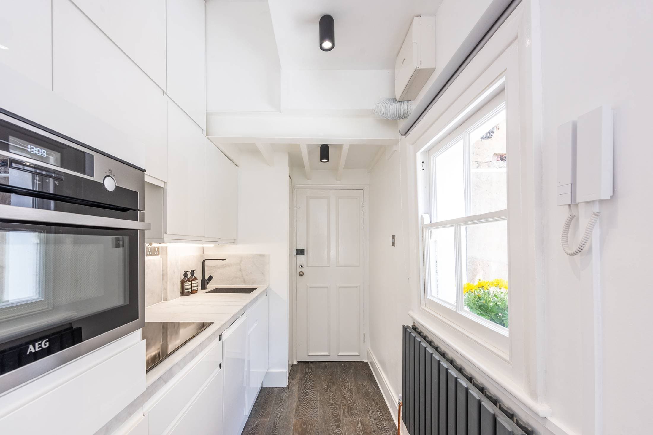 Newly renovated kitchen with marble worktop and induction hob
