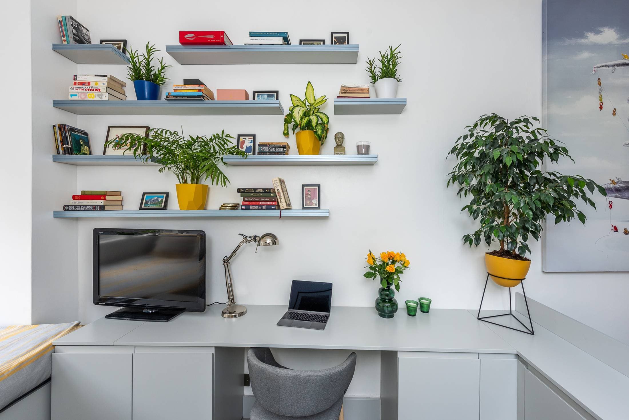 Dedicated workspace upstairs with monitor, laptop stand and fast Wi-Fi