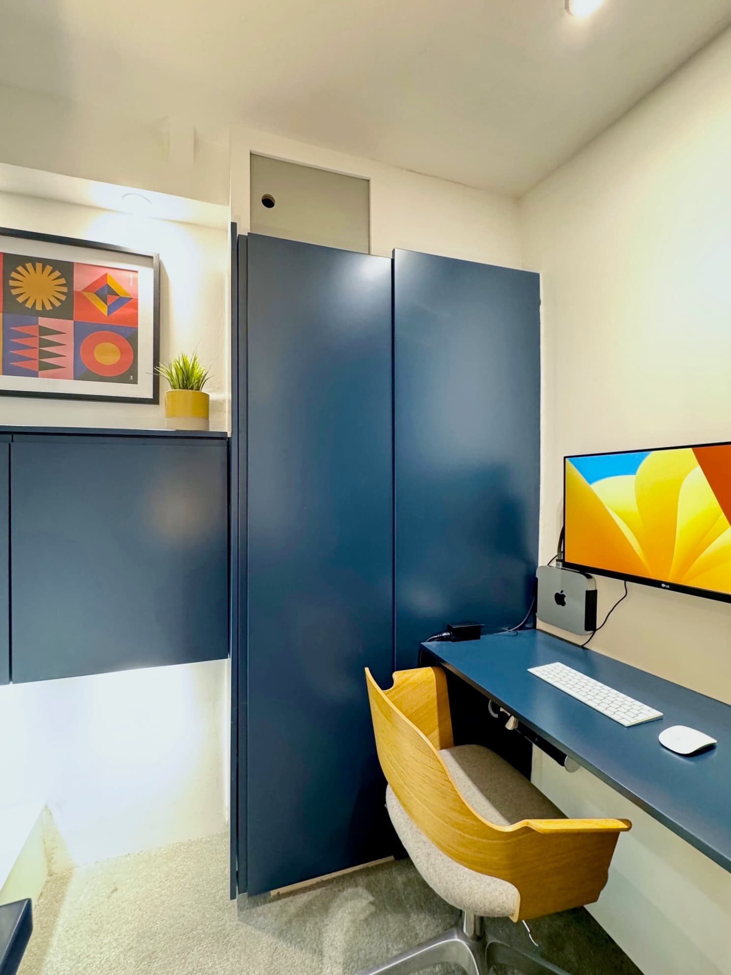 Second bedroom with double bed and integrated workspace
