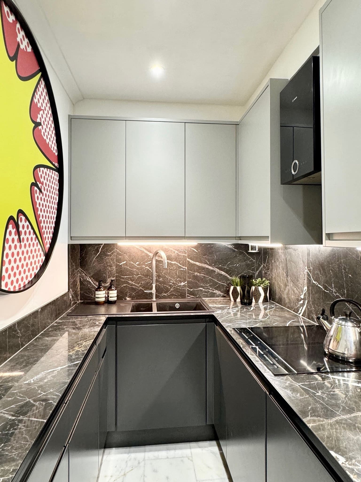 Black and white marble kitchen with Fisher & Paykel appliances and wine fridge